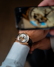 A smartphone screen showing real-time shipment tracking for a luxury watch order.