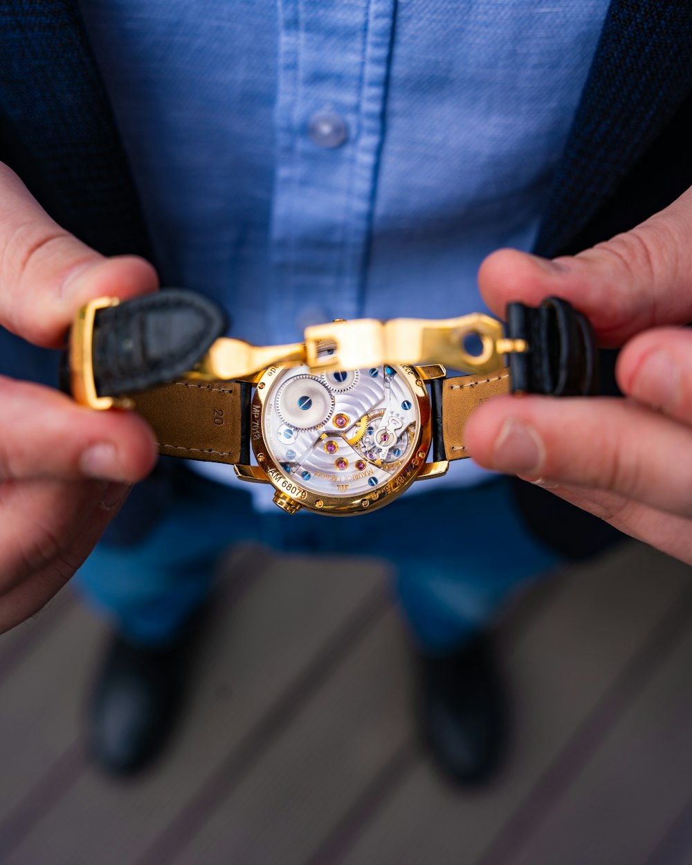 a close up of a person holding a watch