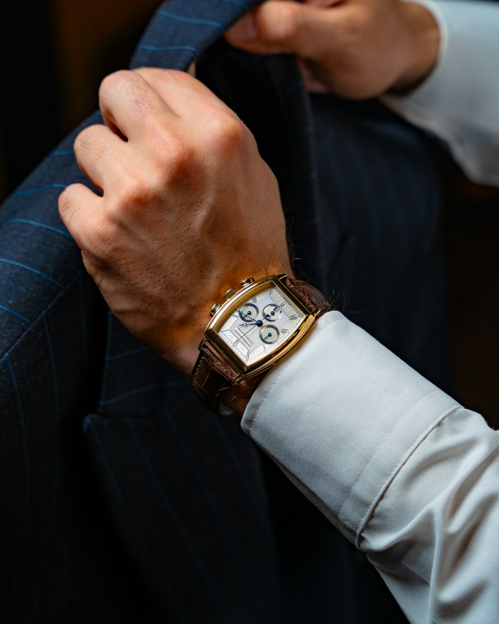 a close up of a person wearing a watch