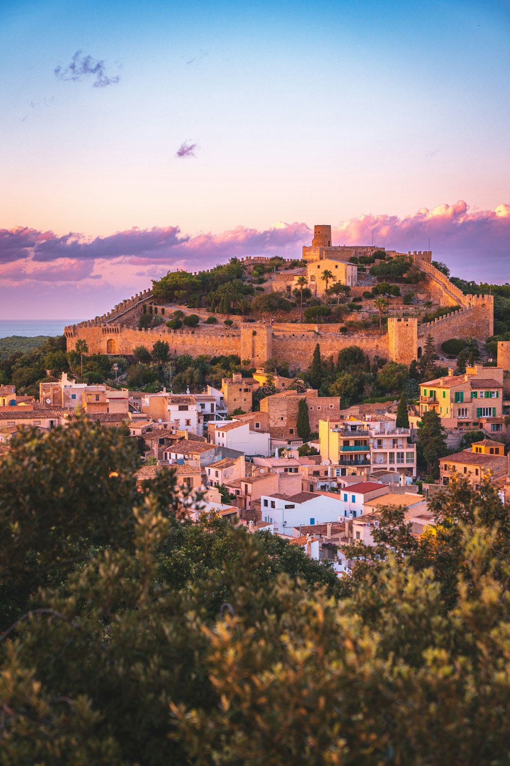 a city with a castle on top of it