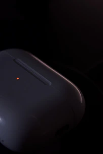 Close-up of a high-tech motion detector with LED indicators glowing softly.