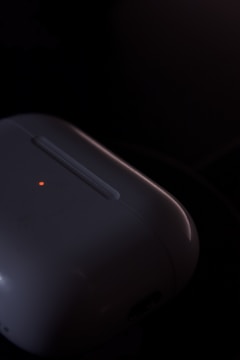 Close-up of a sleek, compact medical device prototype with glowing indicators.