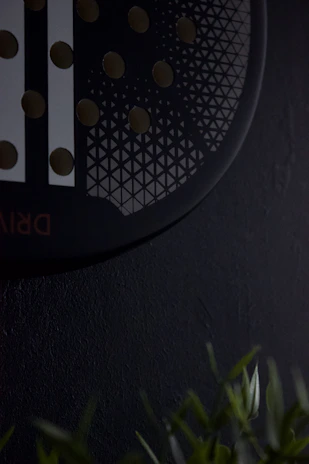 Close-up of the precision mechanical device installed on a hotel shower pipe.
