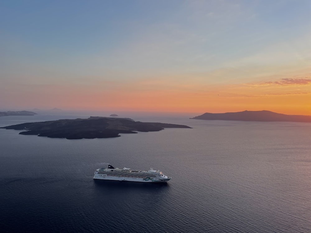 a cruise ship in the middle of a large body of water