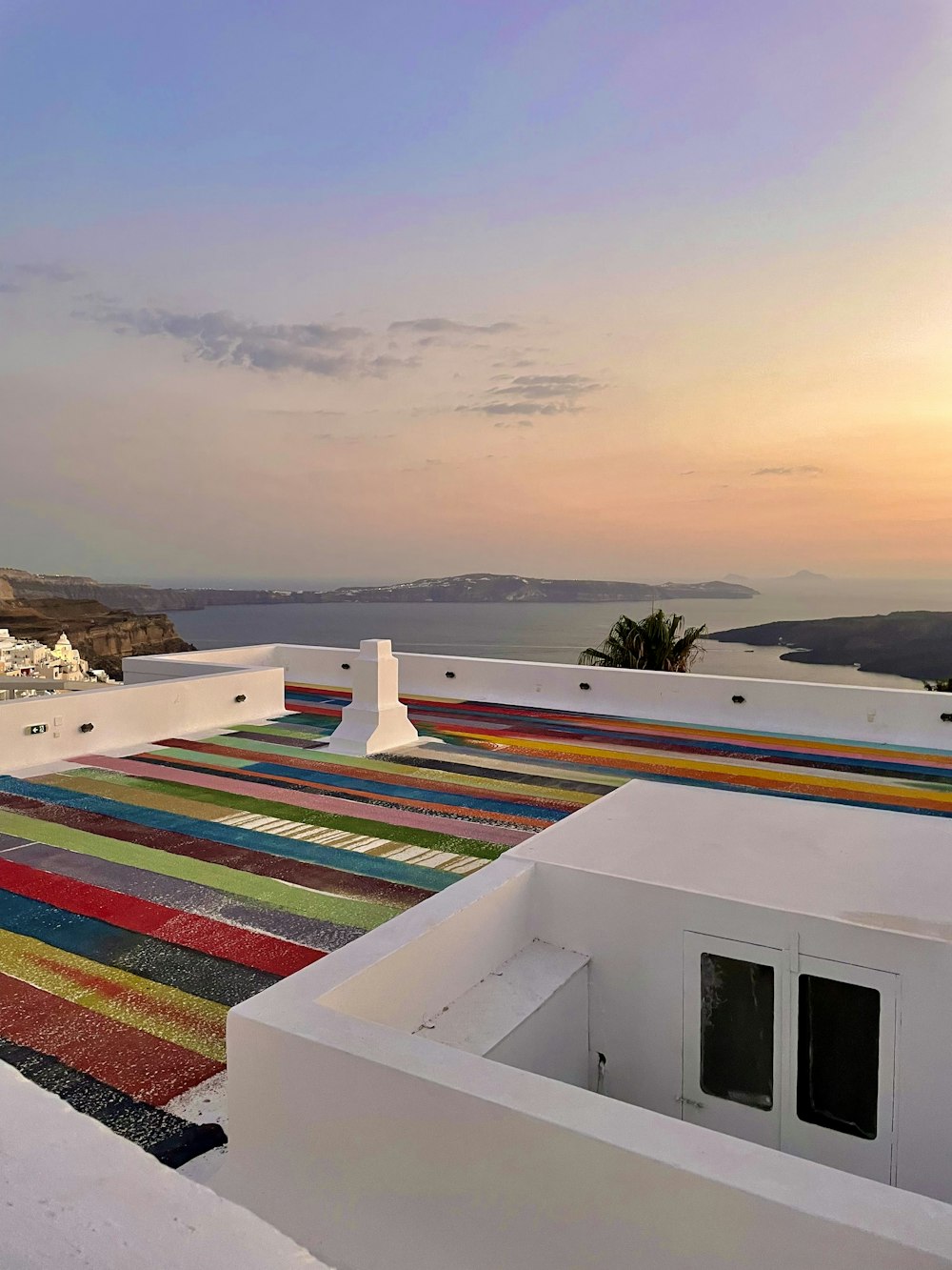 a colorful rug on the roof of a building