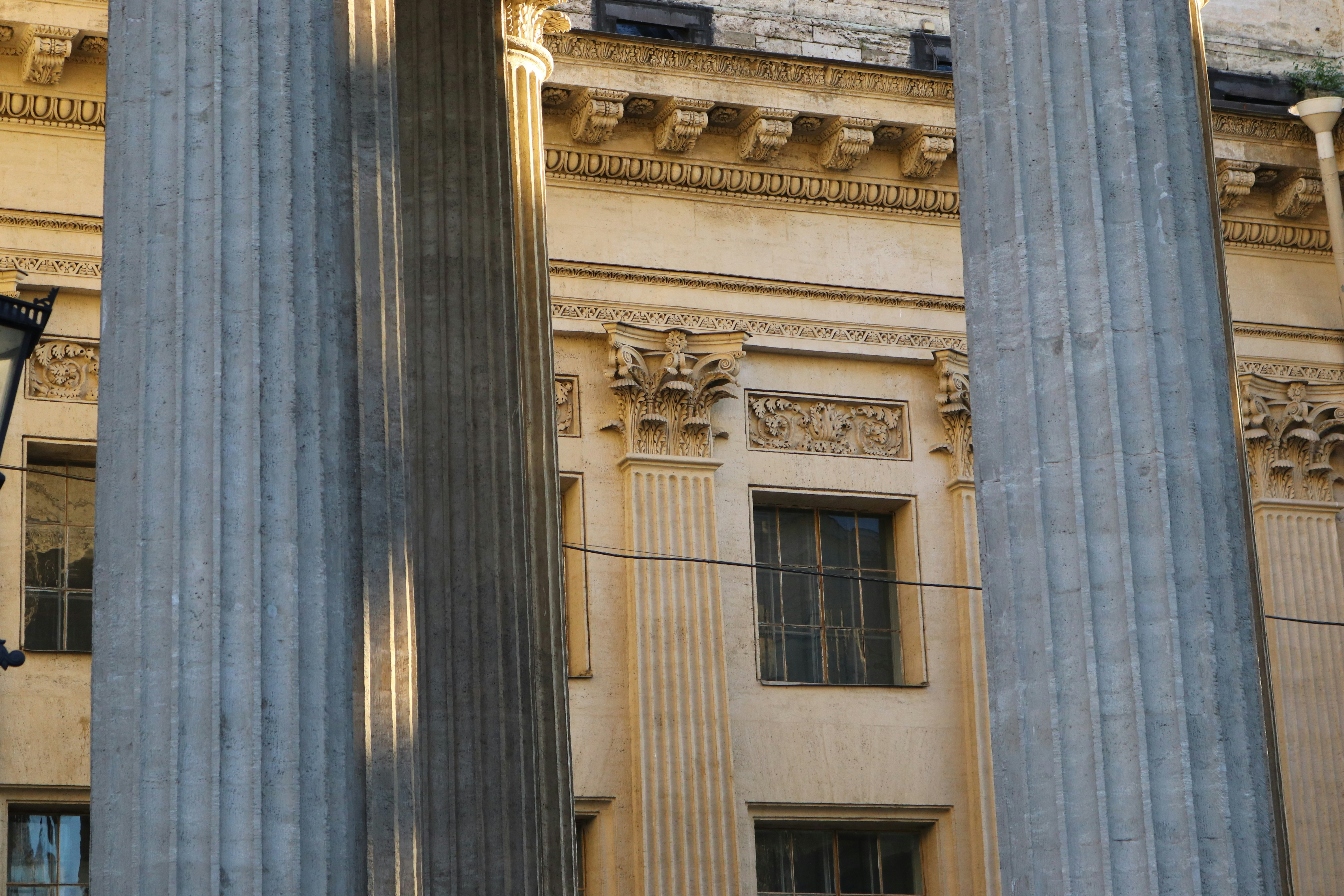 A split image showing two prominent buildings, one with a strong, visible foundation and the other appearing to crumble at its base, illustrating the foundation-superstructure metaphor.