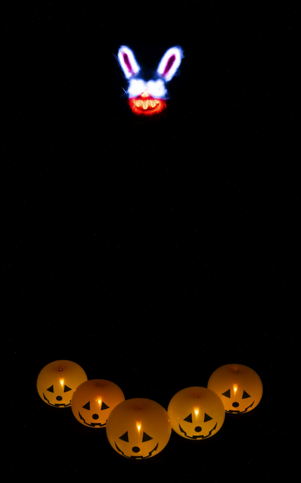 a group of pumpkins with faces on them