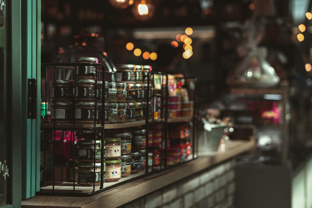 a shelf filled with lots of jars of food