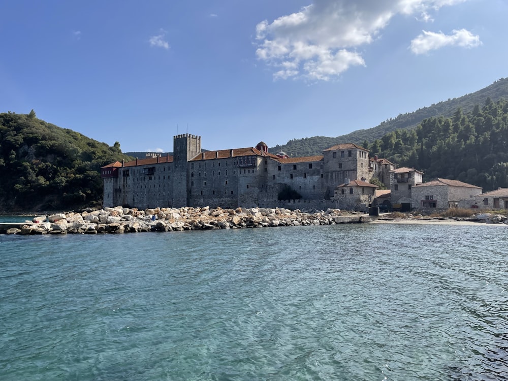 a large building sitting on top of a body of water