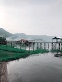 a body of water with a dock in the middle of it