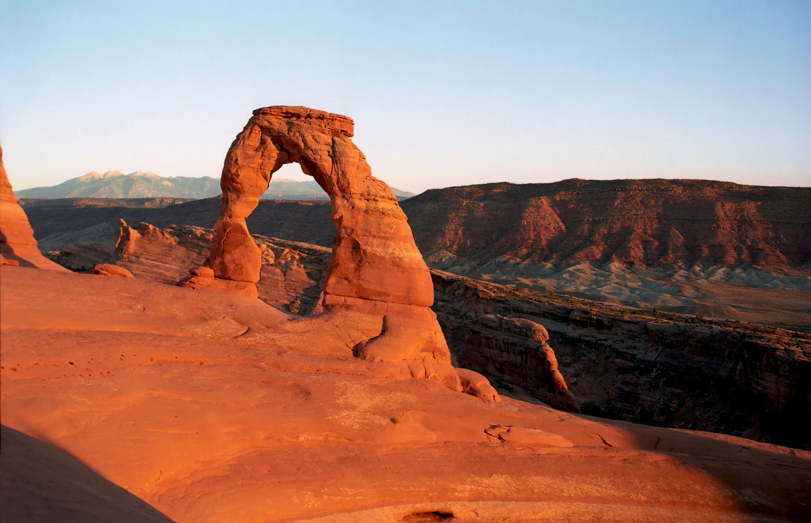 Delicate Arch red rock formation at sunset in Arches National Park near Moab Utah