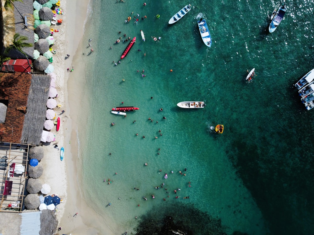 a group of boats floating on top of a body of water