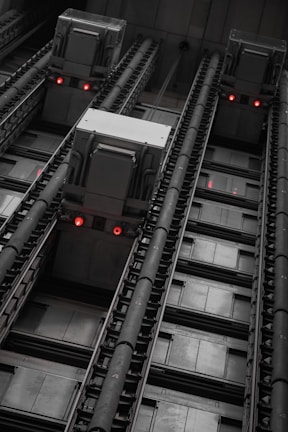 An industrial freight elevator with robust safety features and heavy-duty doors.