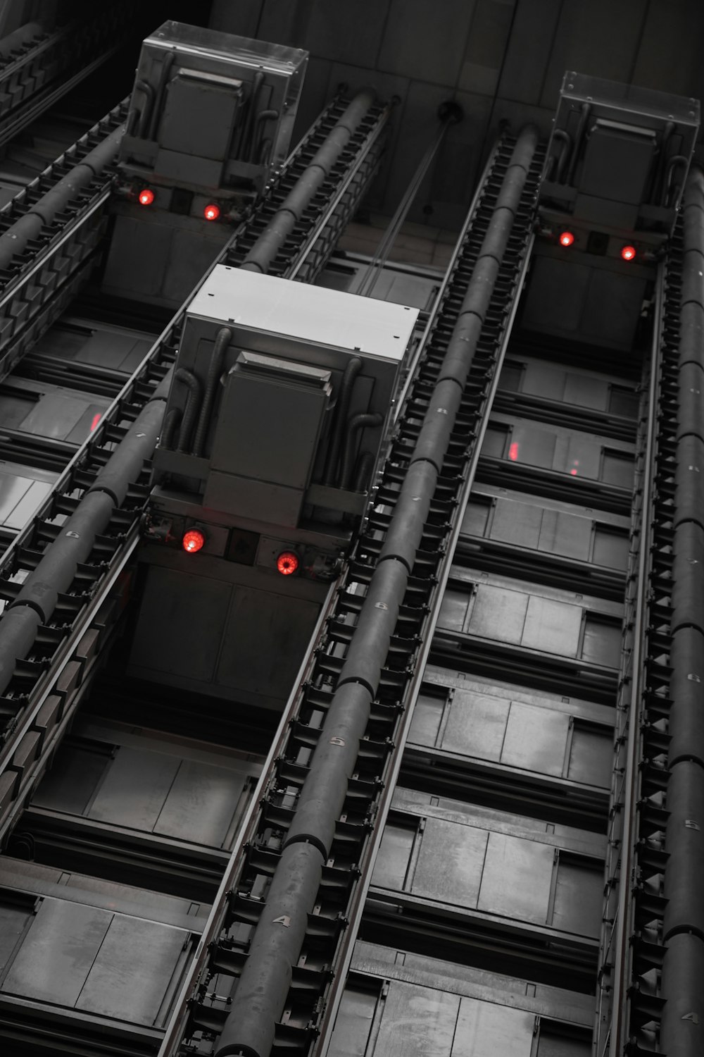 a train on a train track with red lights