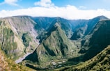 a view of a valley with mountains in the background