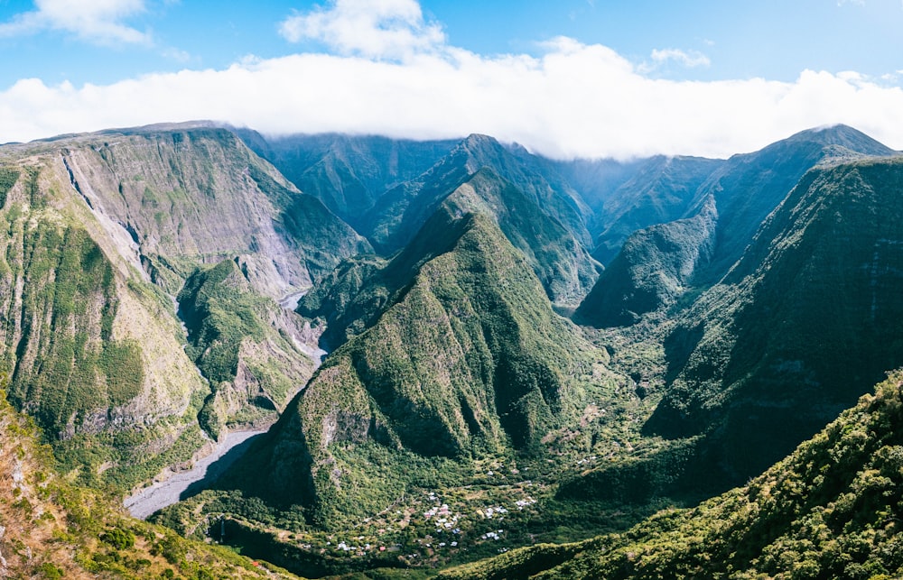 a view of a valley with mountains in the background