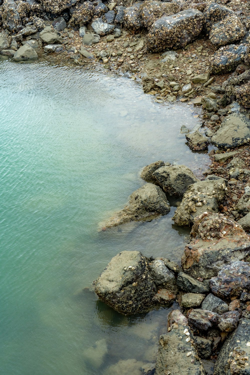 a large body of water surrounded by rocks