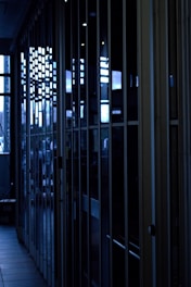Hotel corridor with blue ambient lighting reflecting the brand colors.