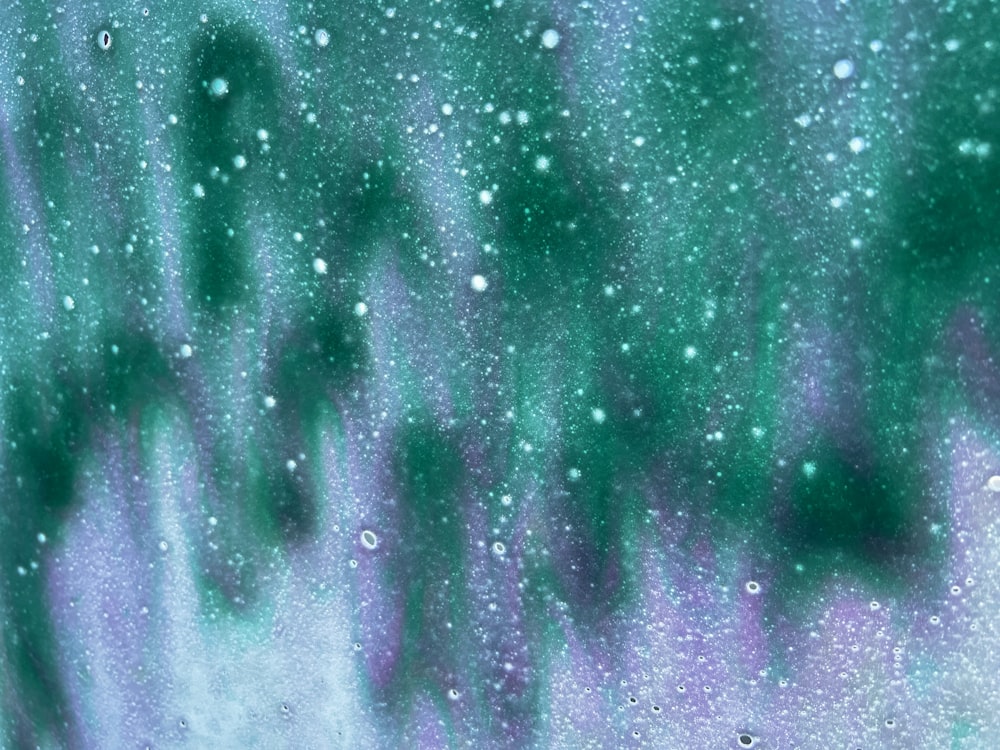 a close up of a window with drops of water on it