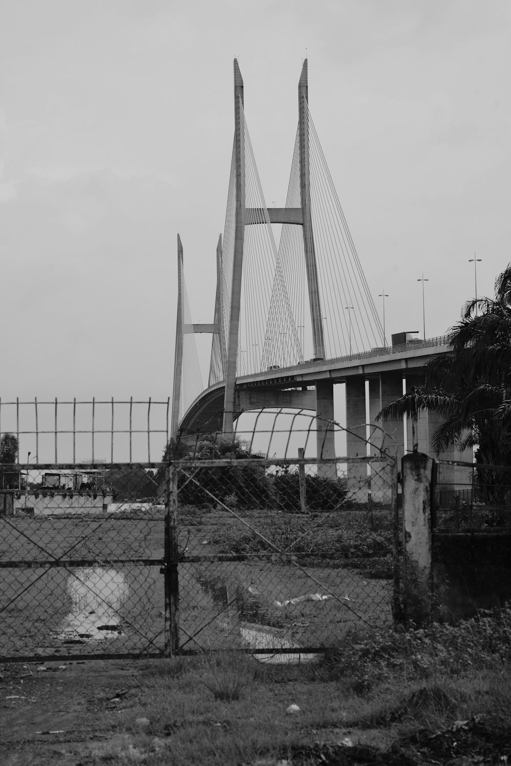 a black and white photo of a bridge