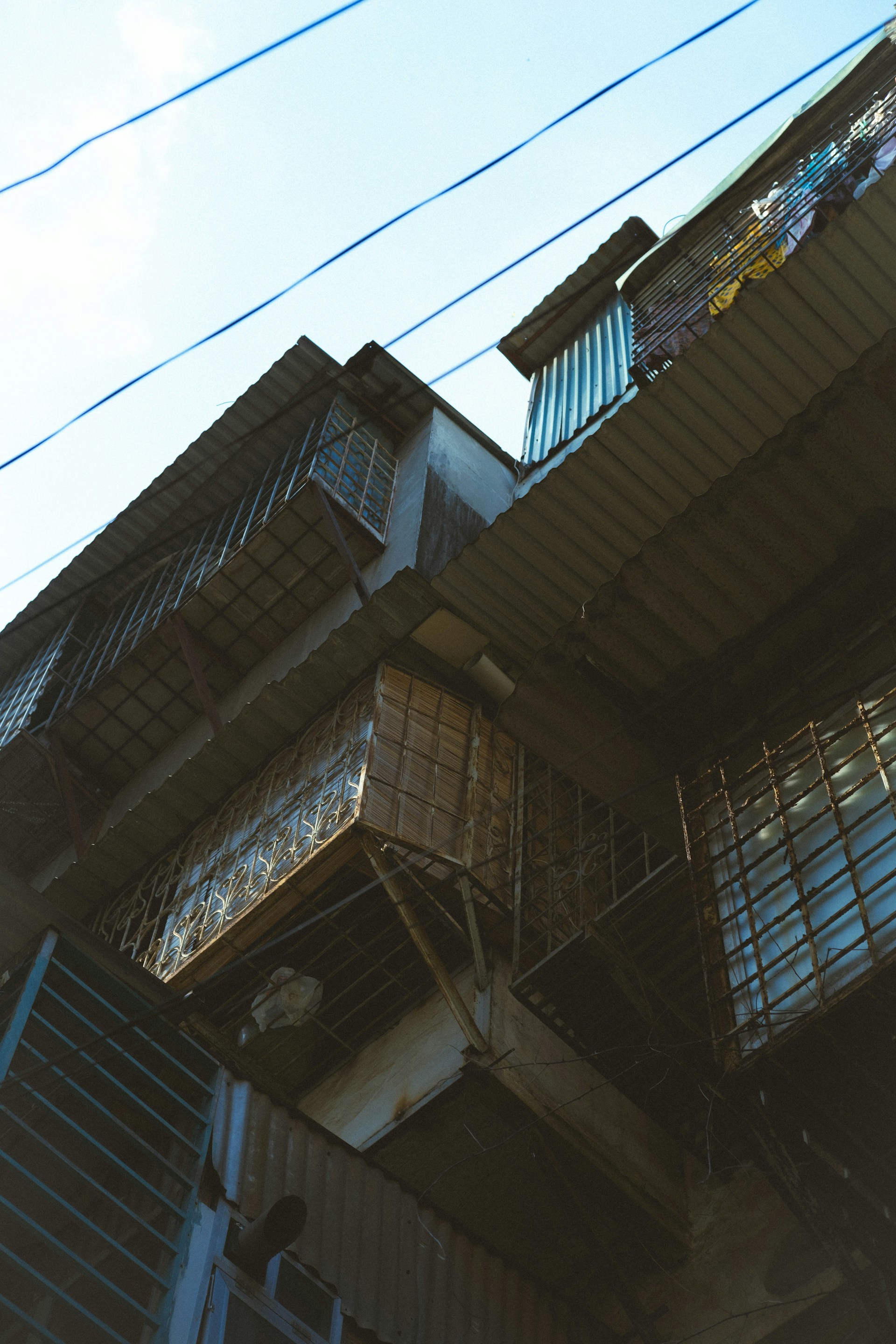 woman wearing yellow long-sleeved dress under white clouds and blue sky during daytime
