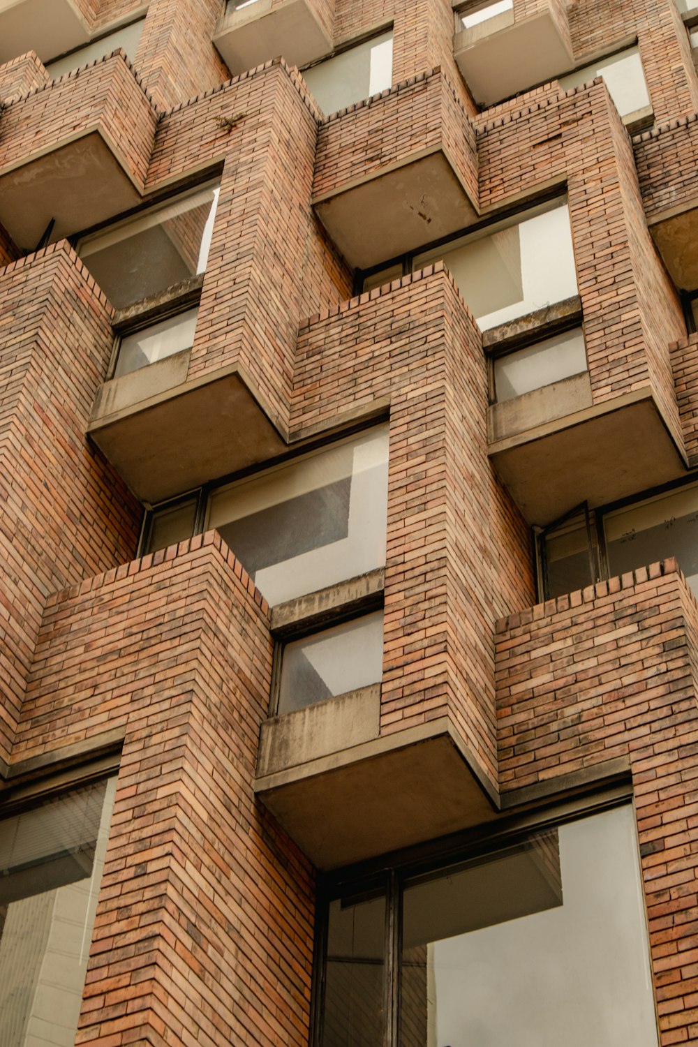 a tall brick building with lots of windows