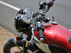 Close-up of hands on a motorcycle handlebar ready for a test ride.