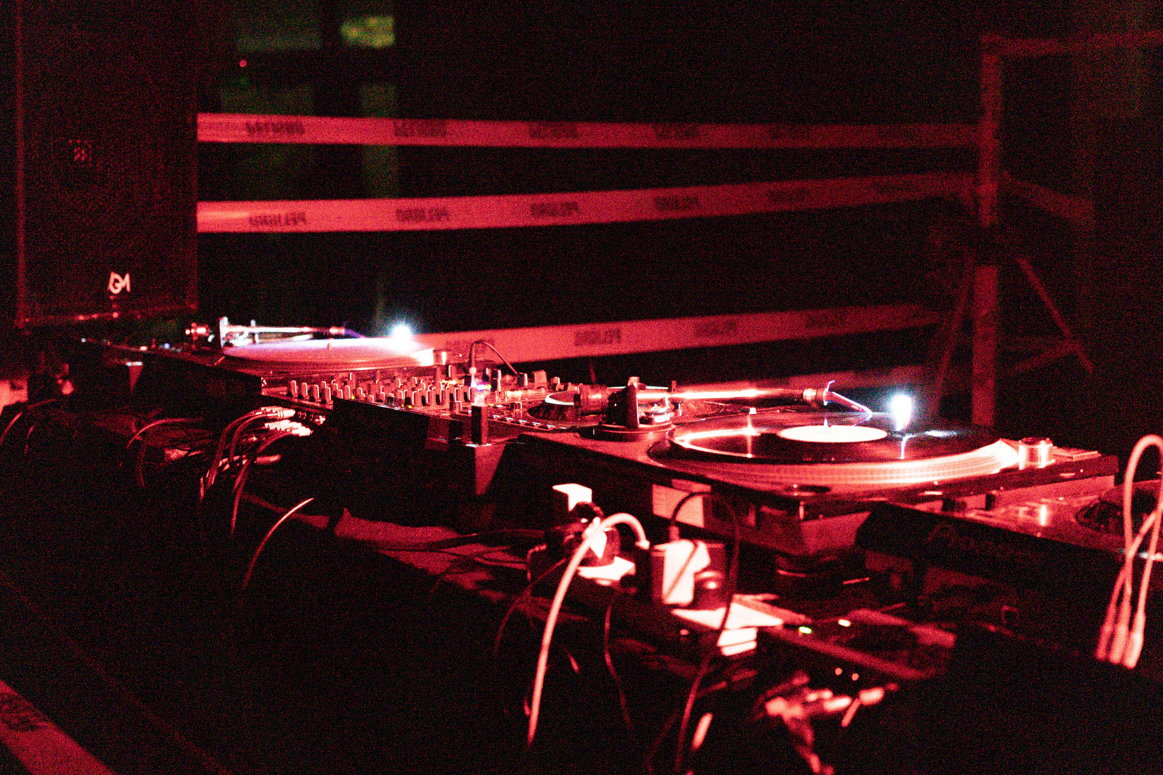 DJ mixing equipment in dark studio