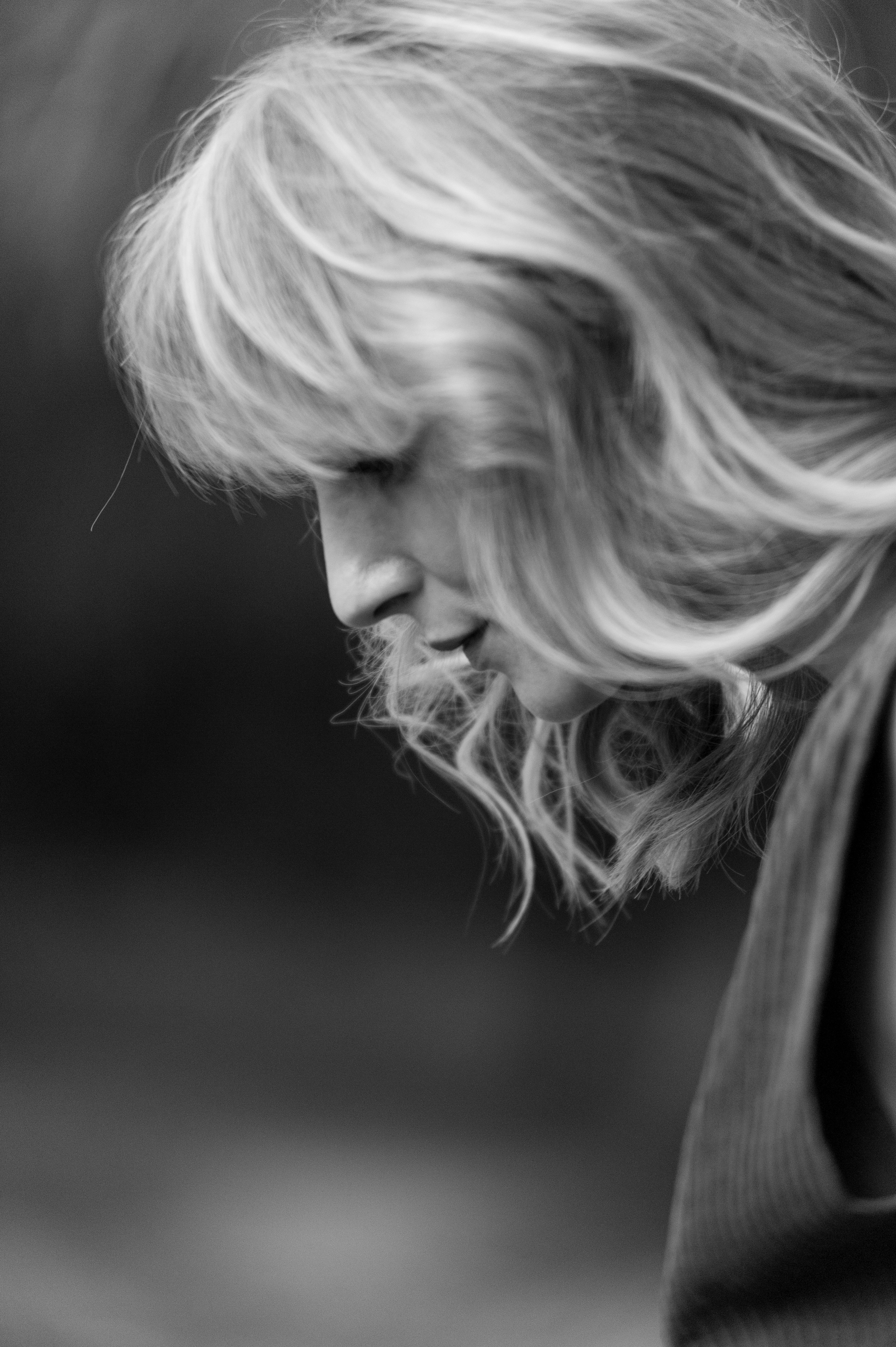 a black and white photo of a woman with blonde hair
