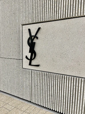 Creative arrangement of multiple brand logos on a textured wall.