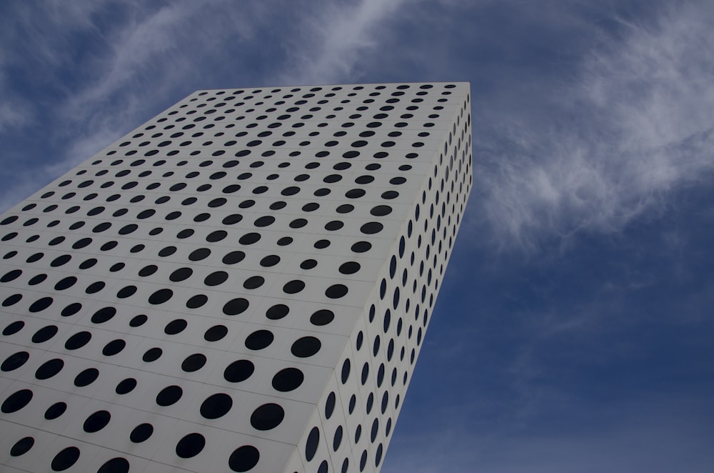 a very tall building with a lot of dots on it