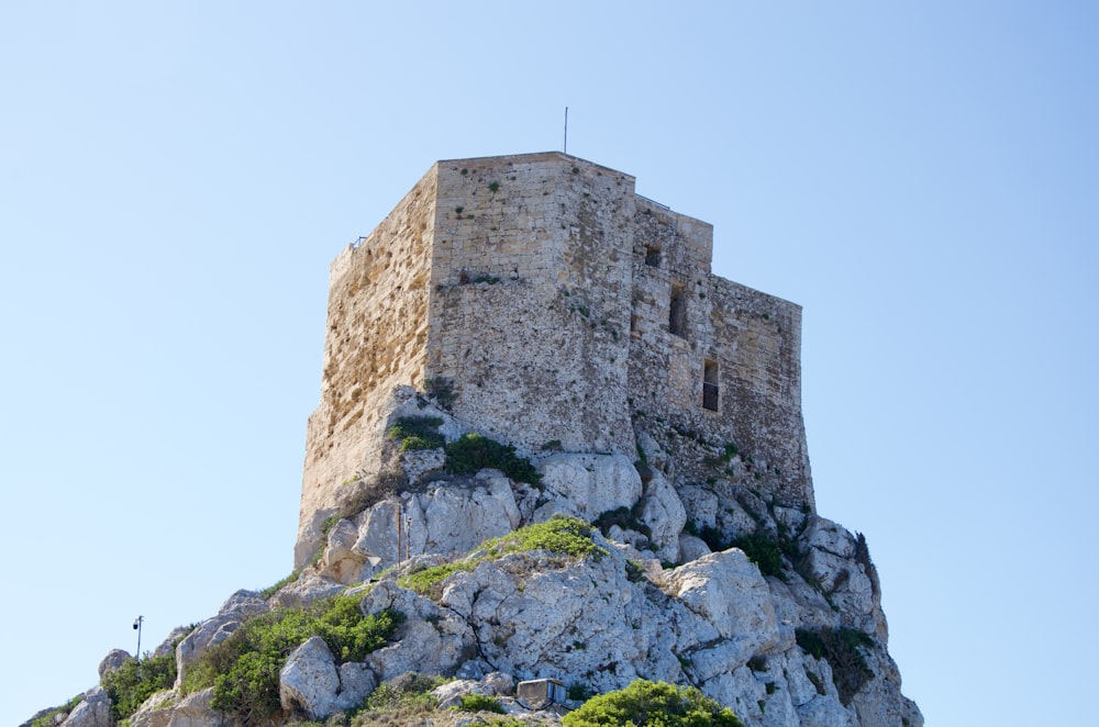 a stone tower on top of a mountain