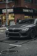 a grey car parked on the side of the road