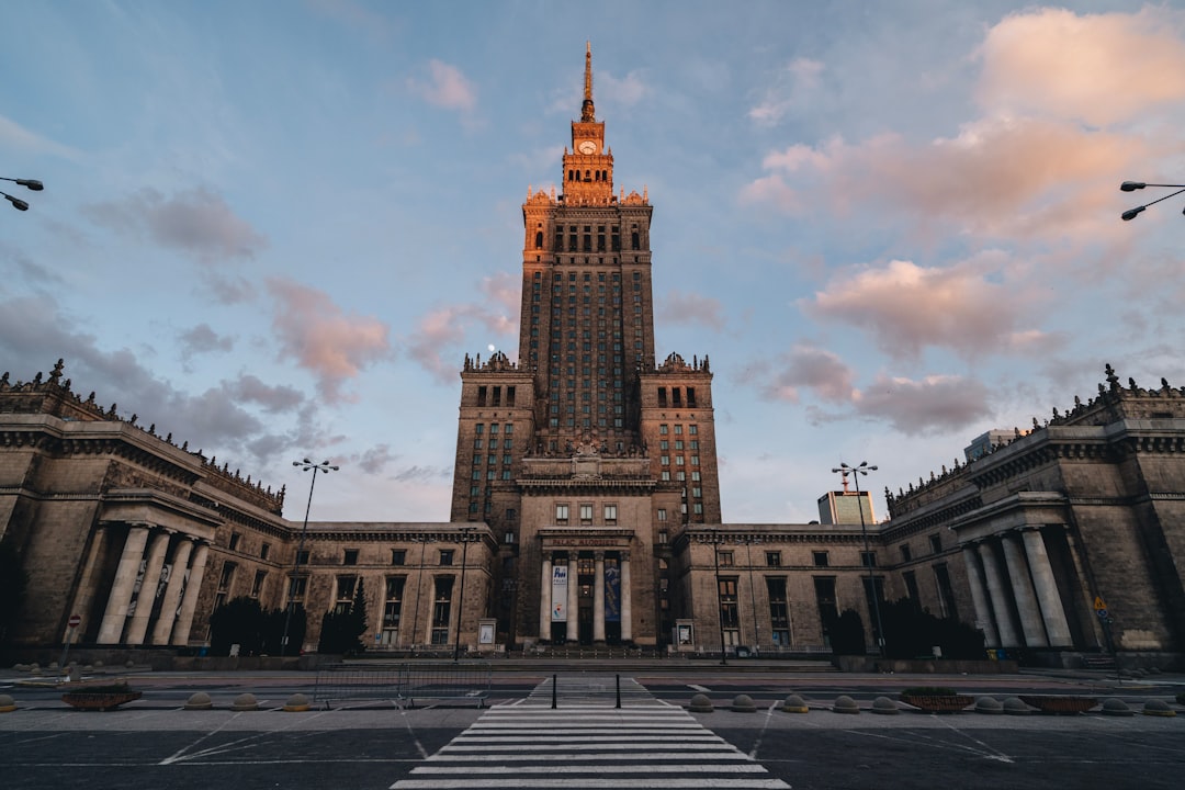 a large building with a clock tower in the middle of it,