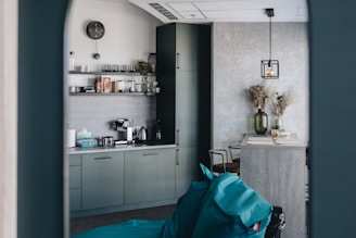 A modern kitchen featuring sleek microcement countertops and walls.