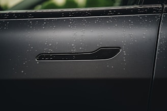 a close up of the door handle of a car