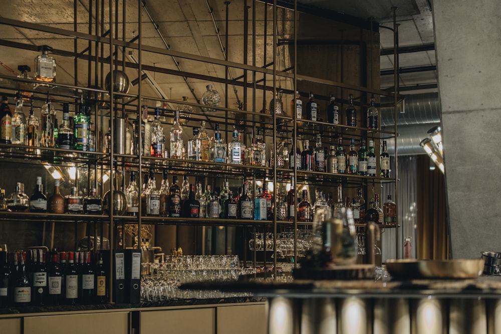 a bar filled with lots of bottles and glasses