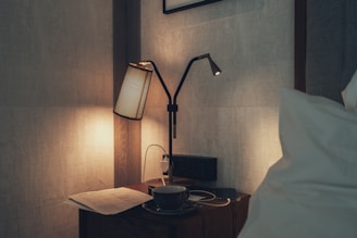 Modern bedside lamps casting a cozy glow in a hotel room
