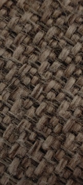 Close-up of recycled fabric textures used in sandal production.