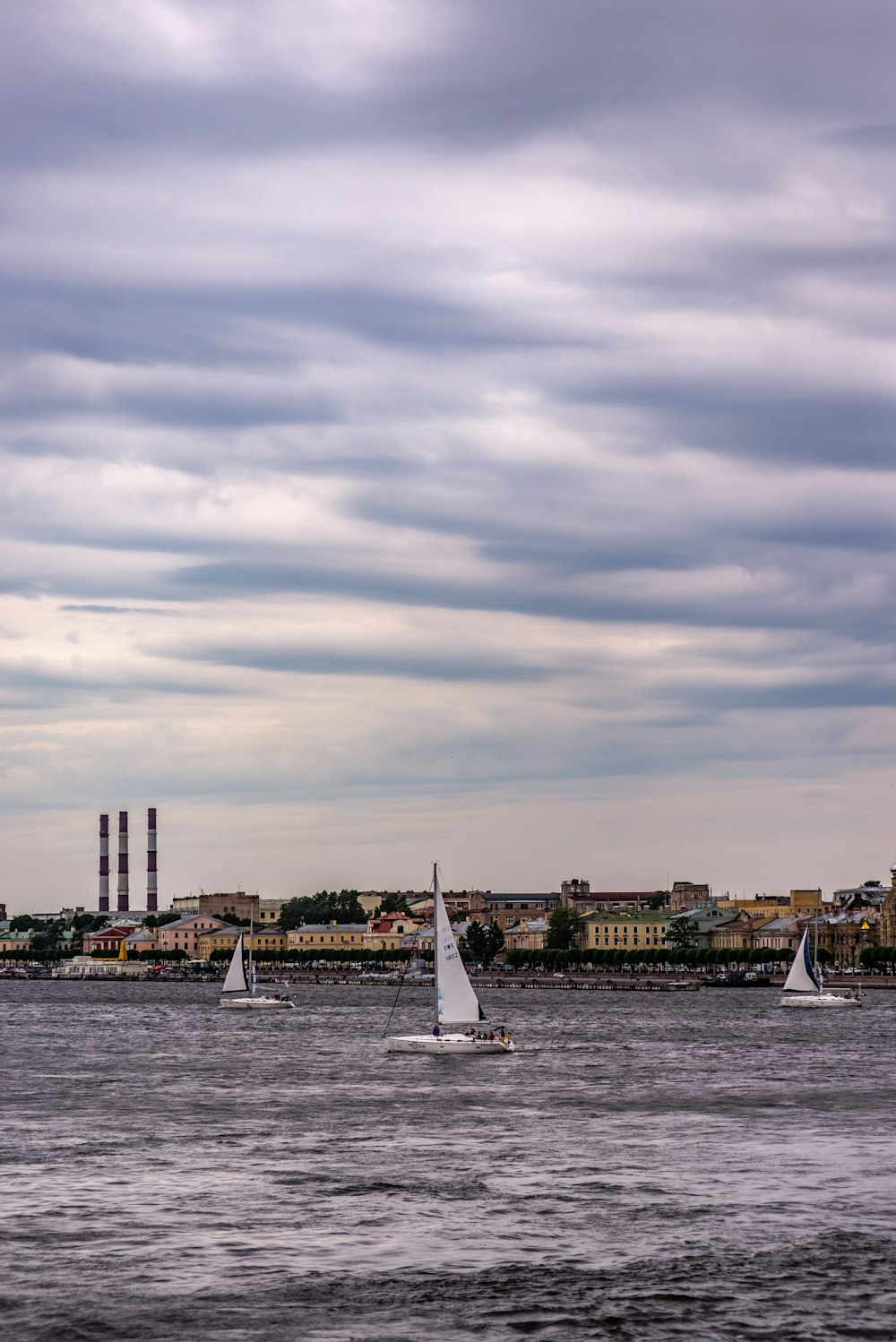 a body of water with a bunch of boats in it