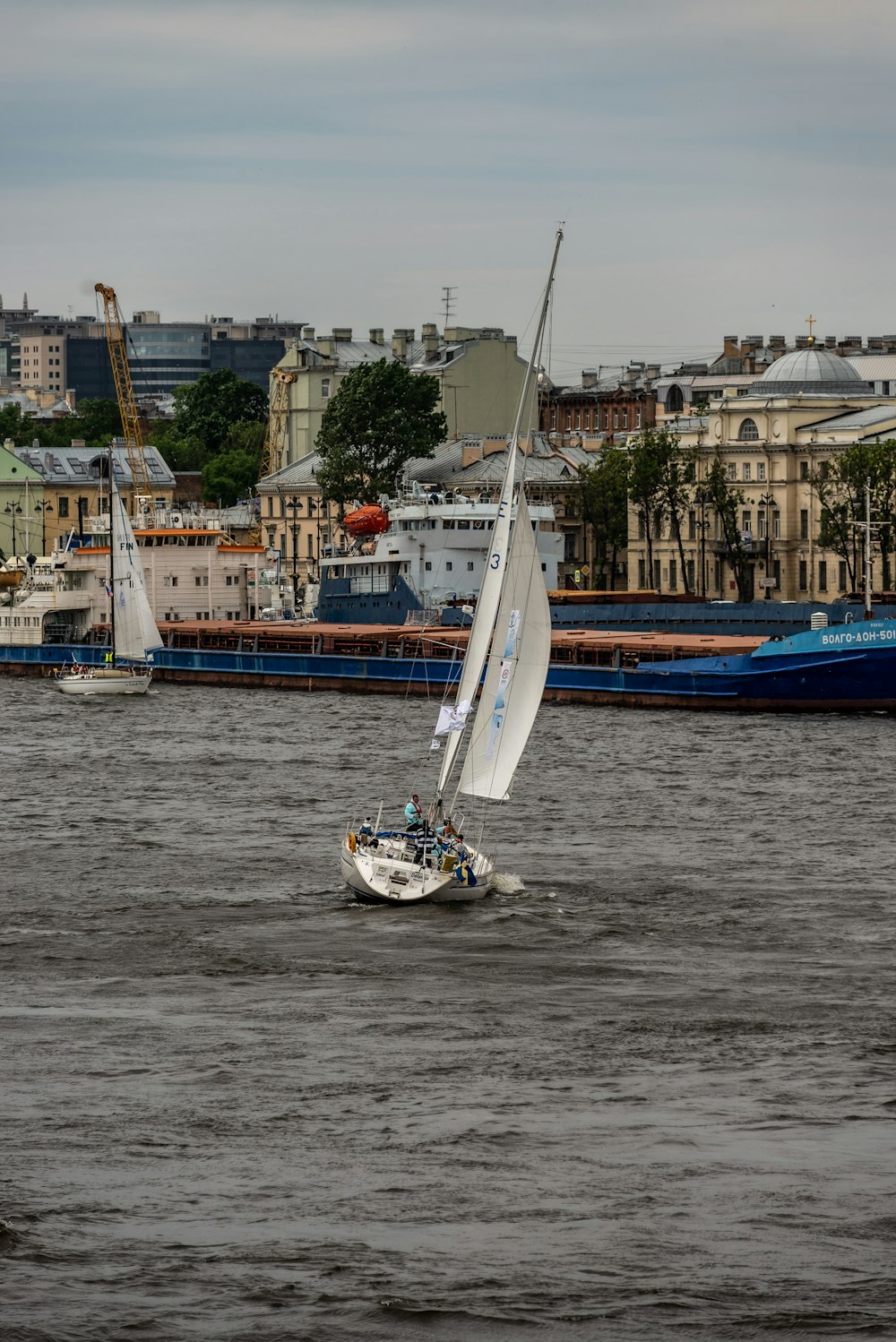 a sailboat sailing on a body of water