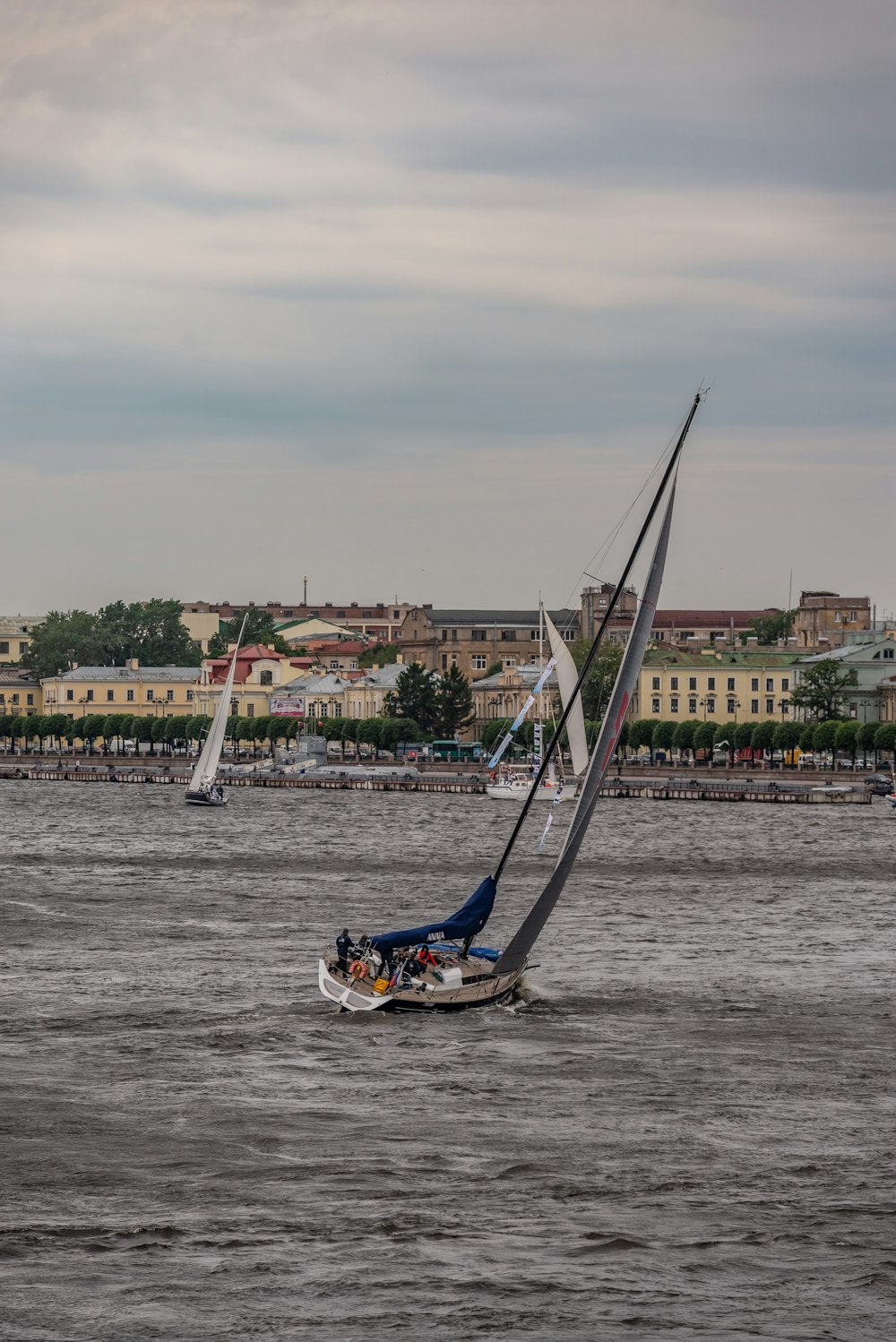 a sailboat sailing on a body of water