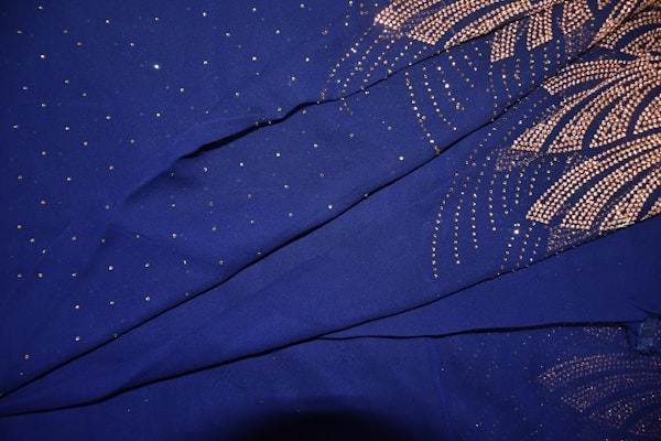 Elegant organza fabrics in royal blue, ideal for festive occasions.