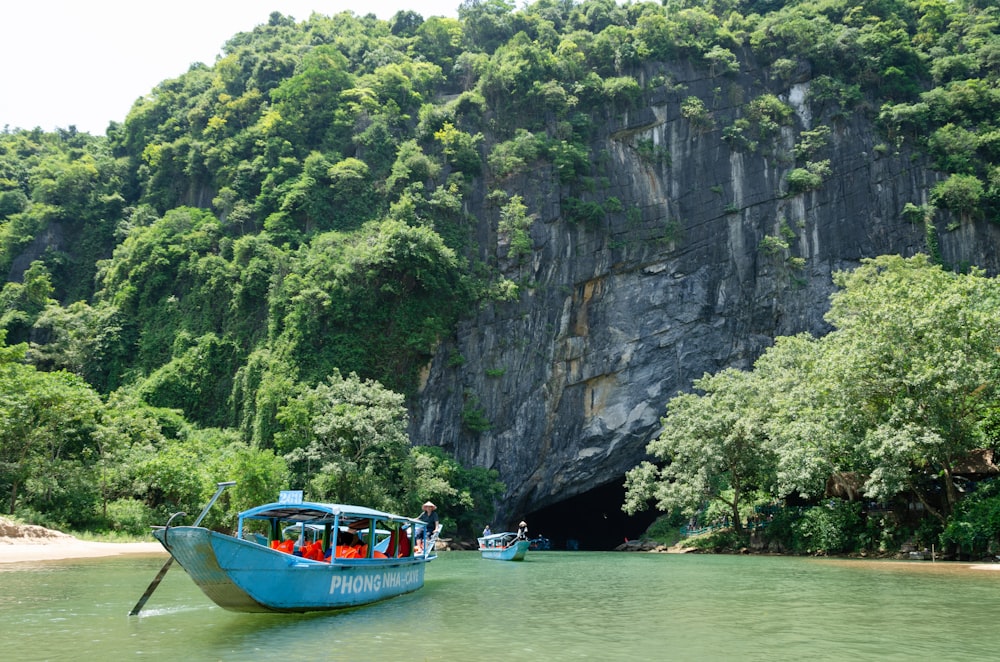 a group of people on a boat in the water