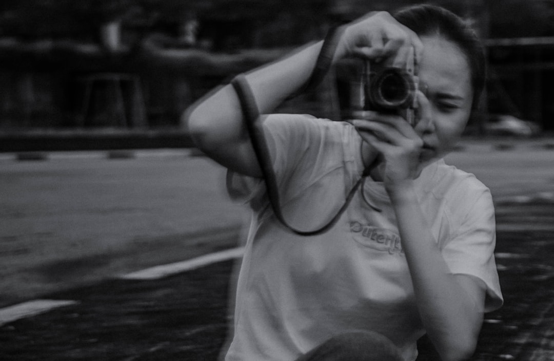 a man taking a picture of himself with a camera,