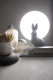 Softly lit image of a decorative table with terracotta and sand color variants