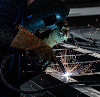 a welder working on a piece of metal