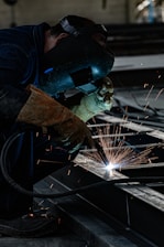 a welder working on a piece of metal