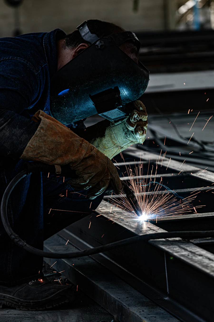 Welder finishing a seam on a custom metal fabrication