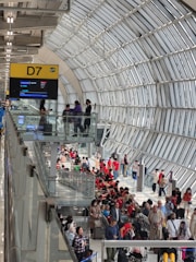 A bustling airport terminal in Durgapur with planes ready for departure.